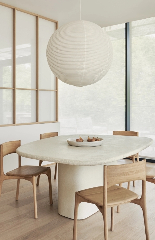 Elements_dining_table_pebble_shape_microcement_pi_dining_chair_Ethnicraft